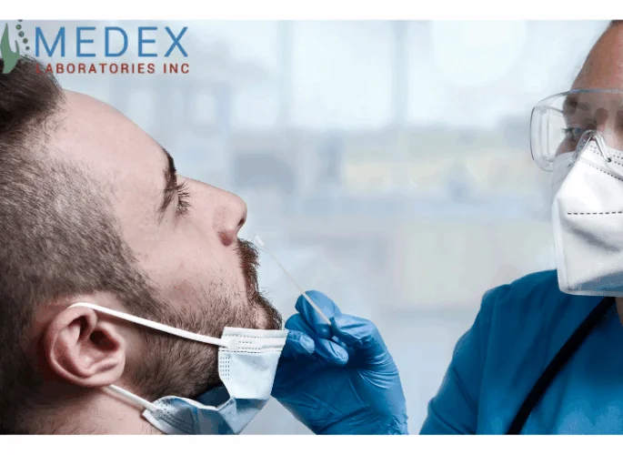Healthcare professional conducting a nasal swab PCR test on a male patient wearing a mask.